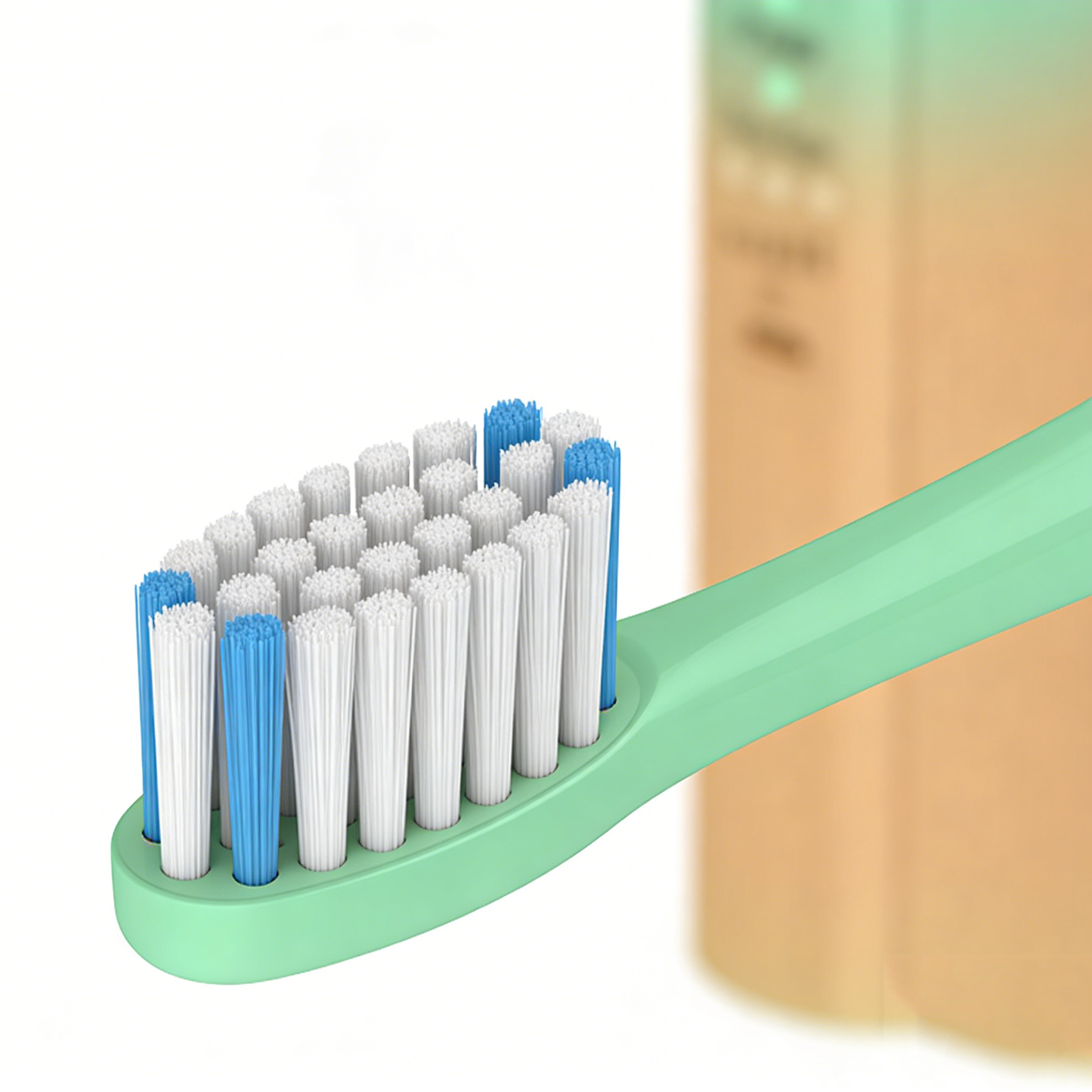 Close-up of the brush head with white and blue bristles on the Art-Color Sonic Electric Toothbrush | PA5118 in green